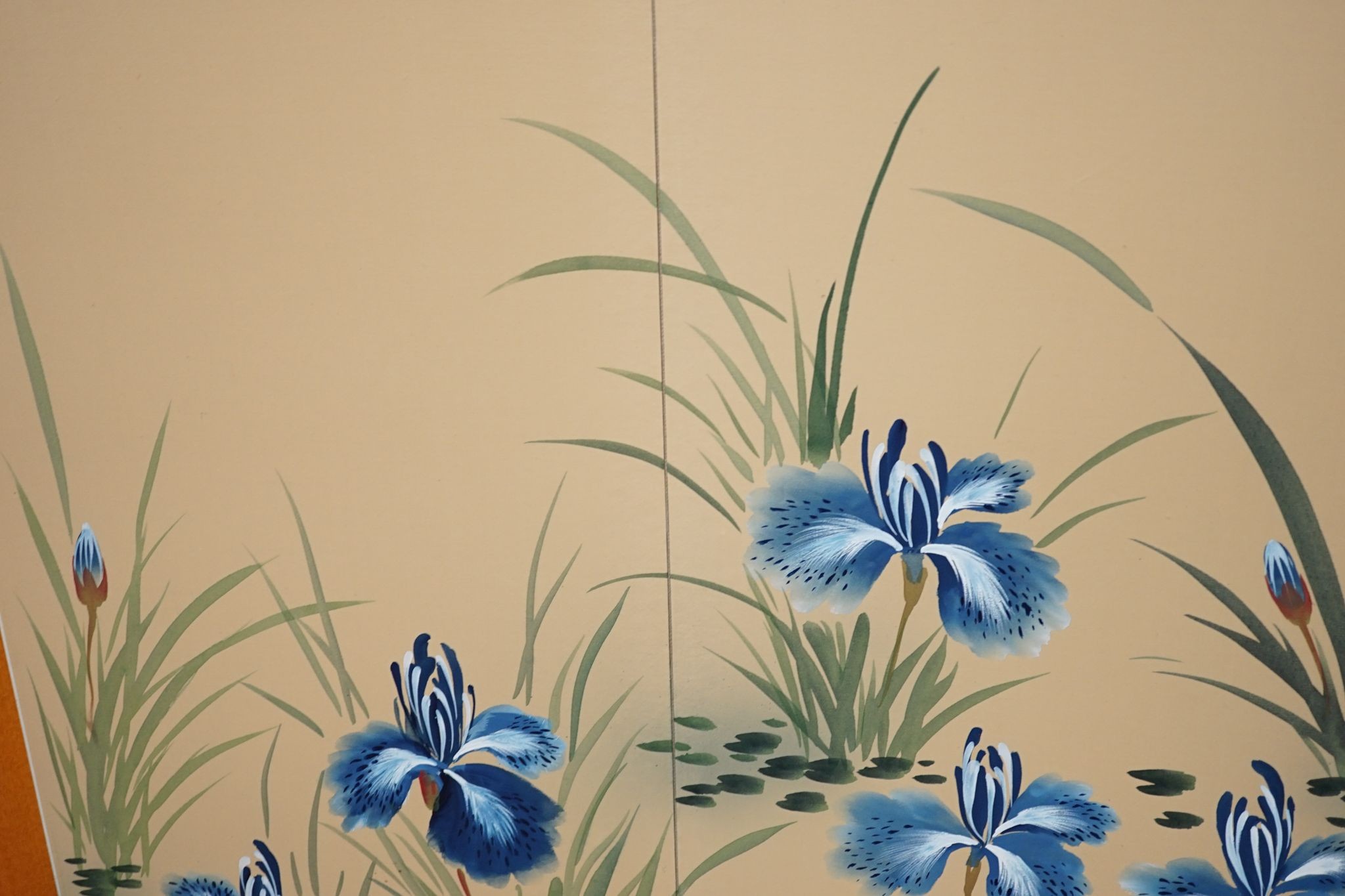 A Japanese painted silk four-fold screen, 152cm full width